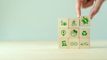 Carbon ecological footprint symbols on wooden cube with eco friendly icon.